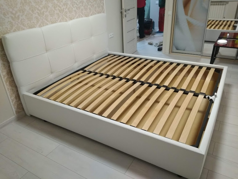ліжко з підйомним механізмом і коробом для зберігання